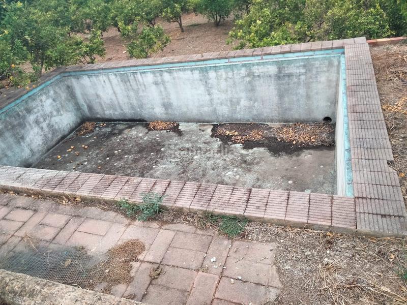 Foto 1f11ad14-9812-4960-94e5-97ef77536a6c. Casa finca rústica con 8 hanegadas de naranjos, 3 oliveros, 3 alemendros, 1 limonero. en Bétera