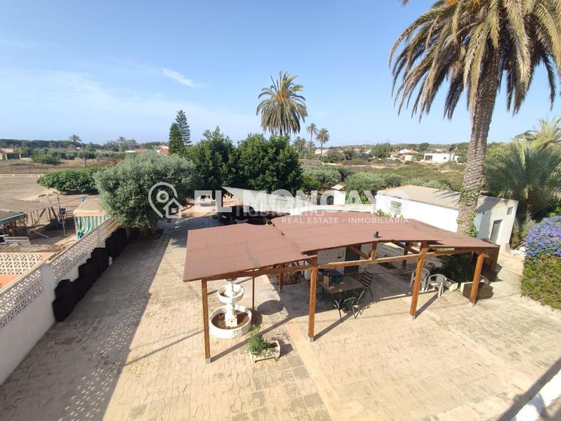 Foto d285aec6-e6ea-4cf7-b283-b31740aeeb71. Chalet fantástica casa de campo con amplia parcela junto al pinet, La Marina, alicante en Elche / Elx