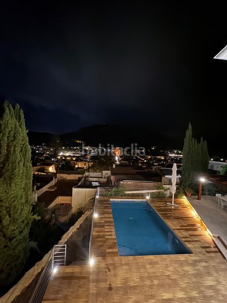 Foto d35d721a-5e9f-4e51-9ca7-461646fd8d9c. Casa encantadora casa de pueblo con terreno y piscina además de unas magníficas vistas a las montañas y al pintoresco pueblo de esporl en Esporles