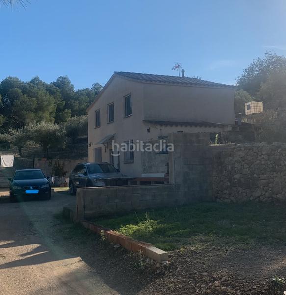 Foto d6e66a5f-aff6-4146-a504-68437fc15c00. Masia amb xemeneia a Perelló (El)