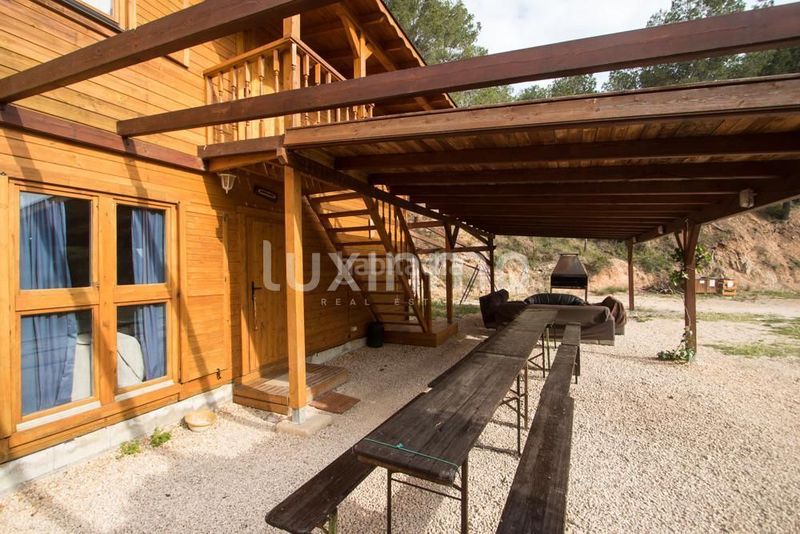 Foto 3e81c377-76df-4b3b-a3a0-64304a6ca130. Chalet se vende una finca y dos cabañas de madera en Finestrat