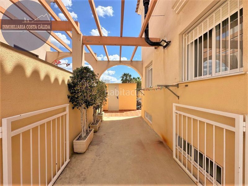 Foto 52c2faf2-686b-455d-b047-ae336d85aa3d. Casa aparellada amb xemeneia calefacció aparcament a Águilas