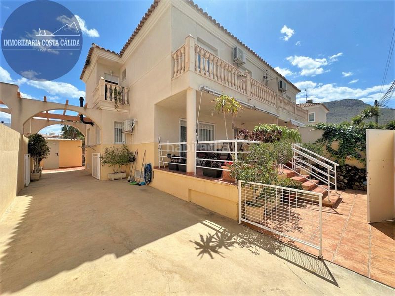 Foto c79de786-737a-4b64-806c-e2f8c059148e. Casa aparellada amb xemeneia calefacció aparcament a Águilas