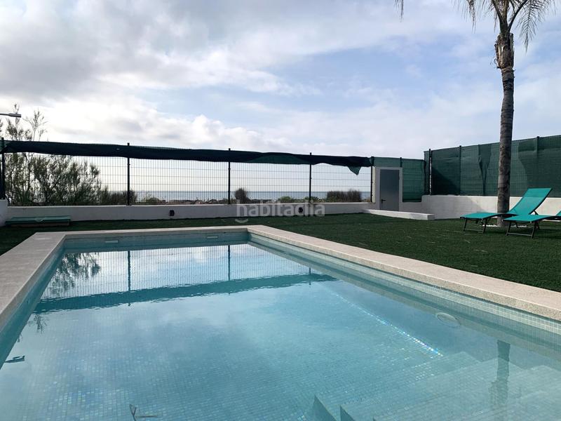 Foto 84827648-e822-4b06-8b39-4d8fbfb46424. Chalet espectacular chalet en primera linea de Playa en Burriana