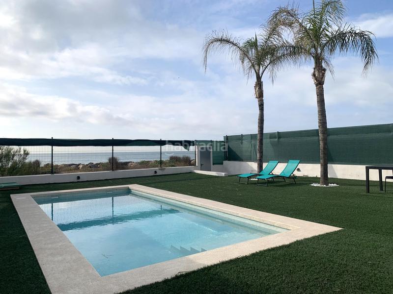 Foto 8c1d15db-9824-4a38-ba8a-1a0bc2641375. Chalet espectacular chalet en primera linea de Playa en Burriana