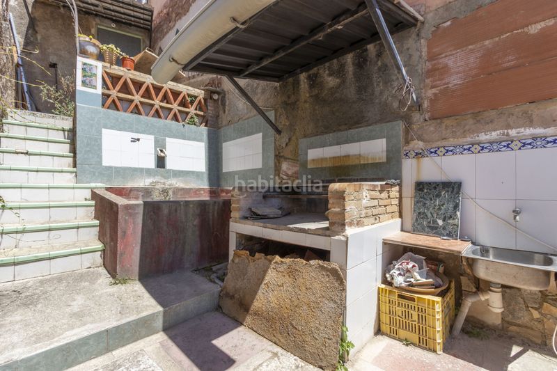 Foto f7cd6ea6-b4ba-4eb8-ac2c-cec089313a57. Casa adossada a Serra