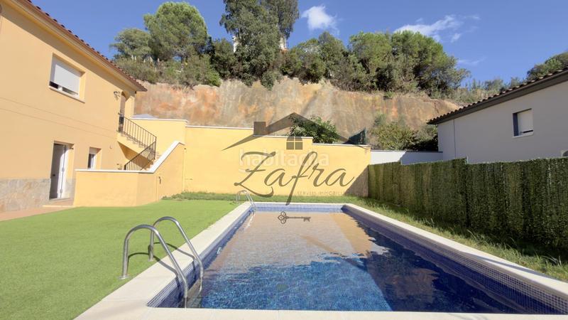 Foto 3c2fead8-b448-45e0-a8a9-b98e5384321e. House with parking pool in Aiguaviva Parc Vidreres