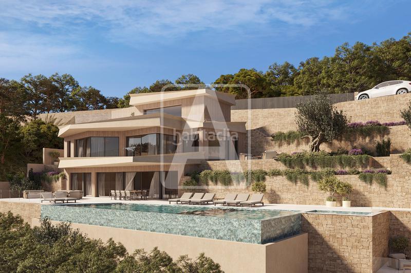 Foto 864beb29-b8de-4d6d-b572-ce12ebf59bff. Chalet avec chauffage parking piscine dans La Fustera Benissa