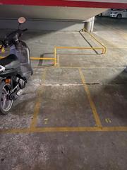 Motorcycle parking in Carrer de València 19