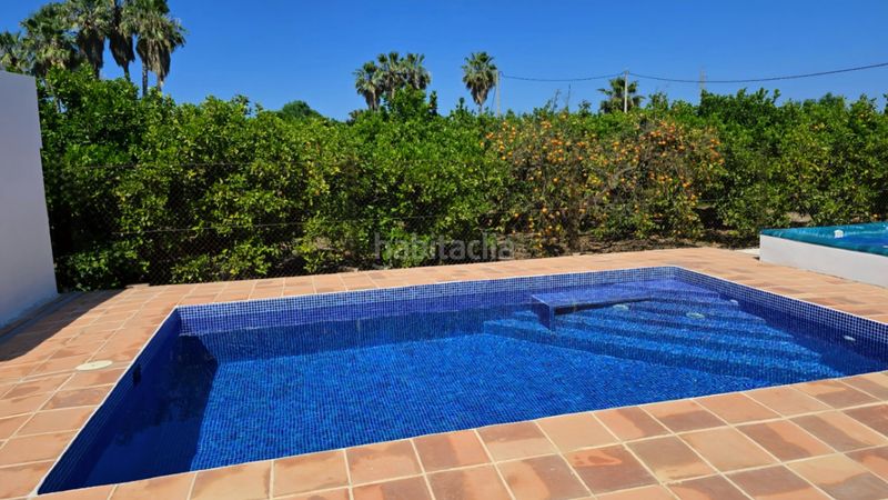Foto d7c8642c-a96c-4ace-b0ce-eb5b73942393. Chalet en Oliva playa Oliva