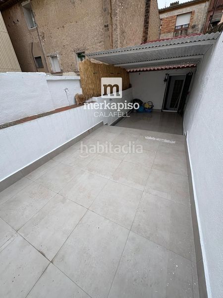 Foto aac1e3a8-1d74-42f1-99cb-1a8c7d5c3a67. Casa amb calefacció a Centre Vendrell (El)