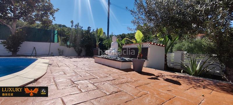 Foto 1d9f9320-b23d-4f58-b6cd-0b511c6c5160. Chalet with fireplace heating parking pool in costa Cunit - els jardins - els rosers Cunit