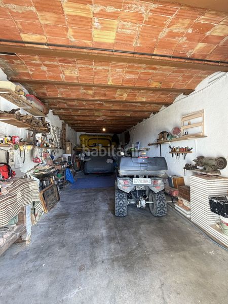 Foto 9df9d7e5-54a8-487d-9017-10e4353b9fde. Parking coche lote de 3 garajes y gran parcela en parque natural en Roses