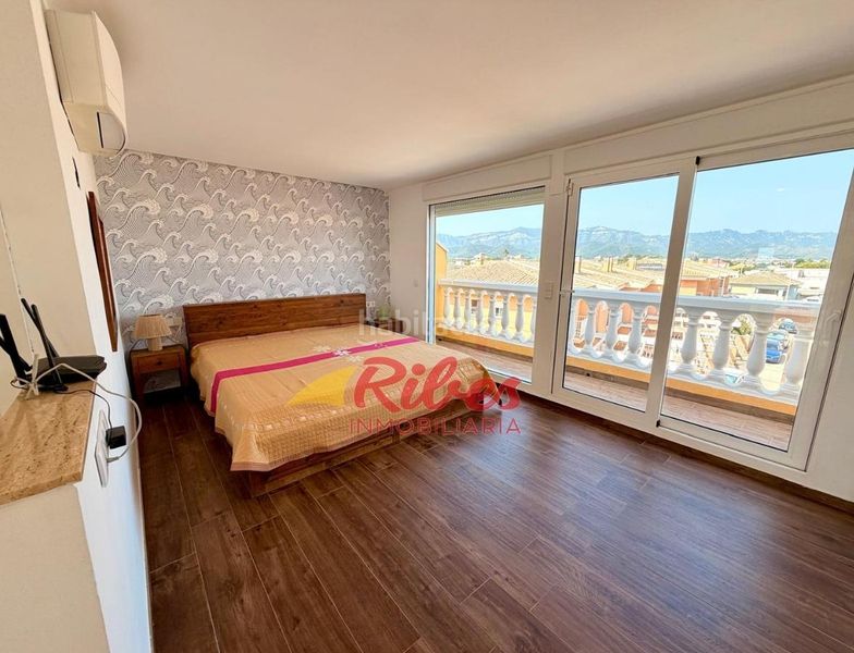 Foto e9bd5ec6-a58d-44d5-962f-9de49aca6bc3. Casa adossada amb aparcament a El Marenyet Cullera