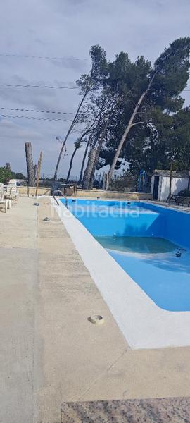 Foto bf497361-a965-43ff-a923-544c40d3c949. Casa amb piscina a Riba - roja de Túria