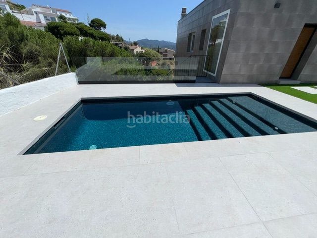 Foto 19bf7dbc-dfa4-4bed-a7b3-a00c7b92075b. Xalet amb xemeneia aparcament piscina a Urbanitzacions Sant Pol de Mar