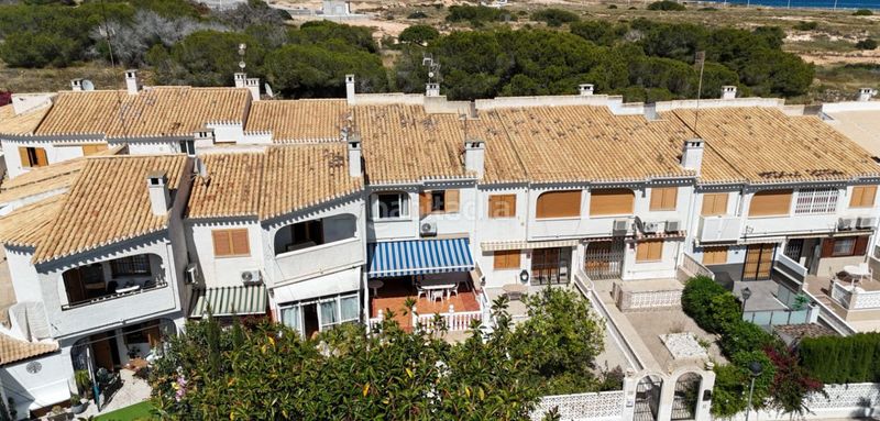 Foto 6e761cf9-29ba-4786-86c5-b46db7cdfb24. Casa adossada a Playa Flamenca Orihuela