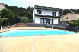 Xalet a Bigues i Riells. Casa con piscina