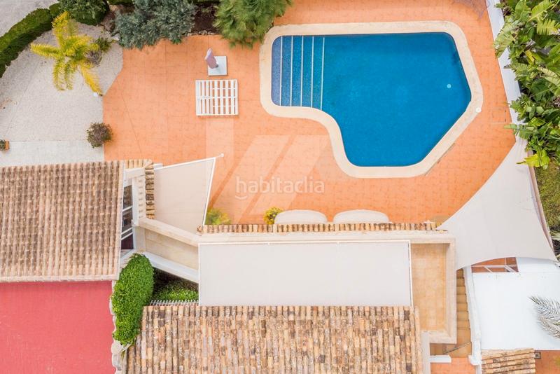 Foto 216daddf-a022-4560-8d91-2ae013419be3. Chalet con riscaldamento parcheggio piscina in El Portet-Pla del Mar Moraira