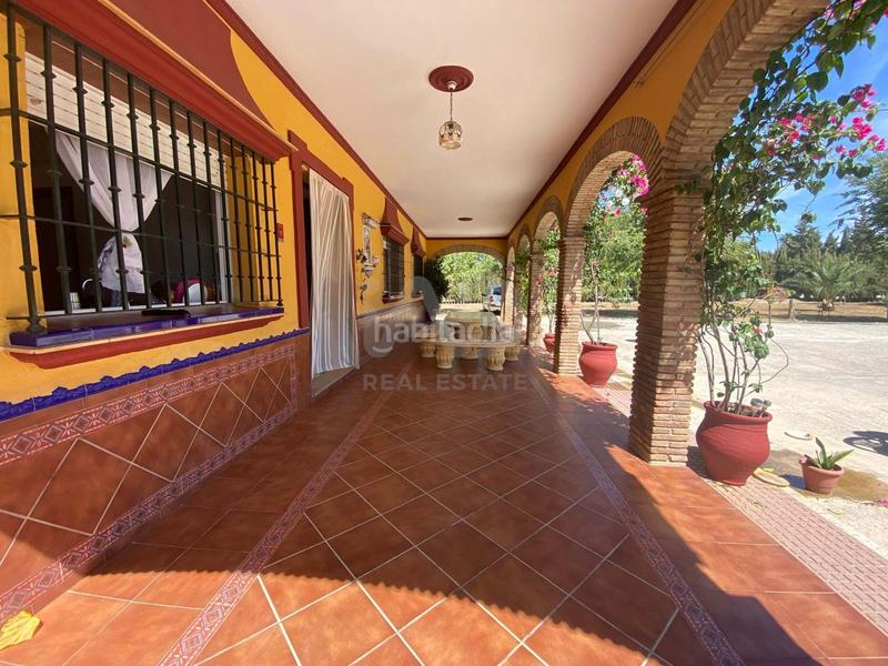 Foto b6ecf834-48a6-4879-9f78-265bec581460. Finca rústica en Lora del Río