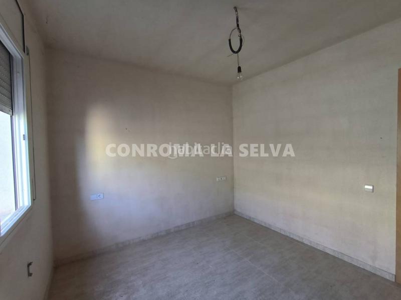 Foto 642994d3-ff68-4330-8e55-37a2f5c2b6e8. Casa vivienda por terminar con dos espaciosos locales en Maçanet de la Selva