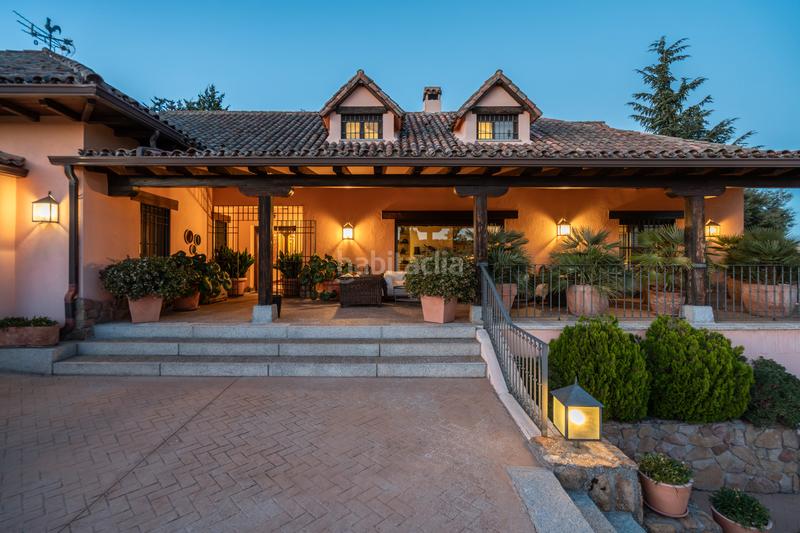 Foto 360cbe6b-eb81-4d5b-a1b1-da3630d34e25. Xalet amb xemeneia calefacció piscina a Manzanares el Real