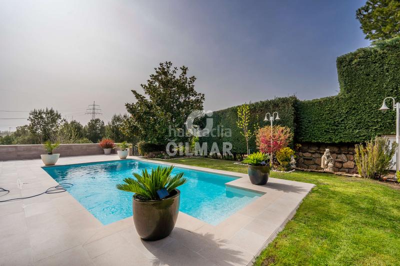 Foto 0aa3cdb3-b22d-45c0-823b-9efdd2fea47c. Casa a schiera con riscaldamento parcheggio piscina in Madrid