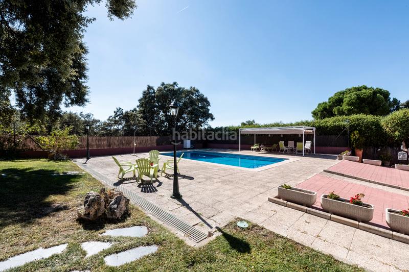 Foto eafc9079-8321-43a5-9743-180bff0fa9e6. Xalet amb xemeneia calefacció aparcament piscina a Villaviciosa de Odón