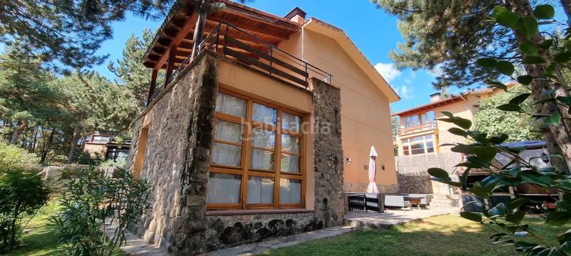 Foto bf943b9d-ca6f-4de0-b41e-44debf394cfe. Chalet with fireplace heating in Mataelpino