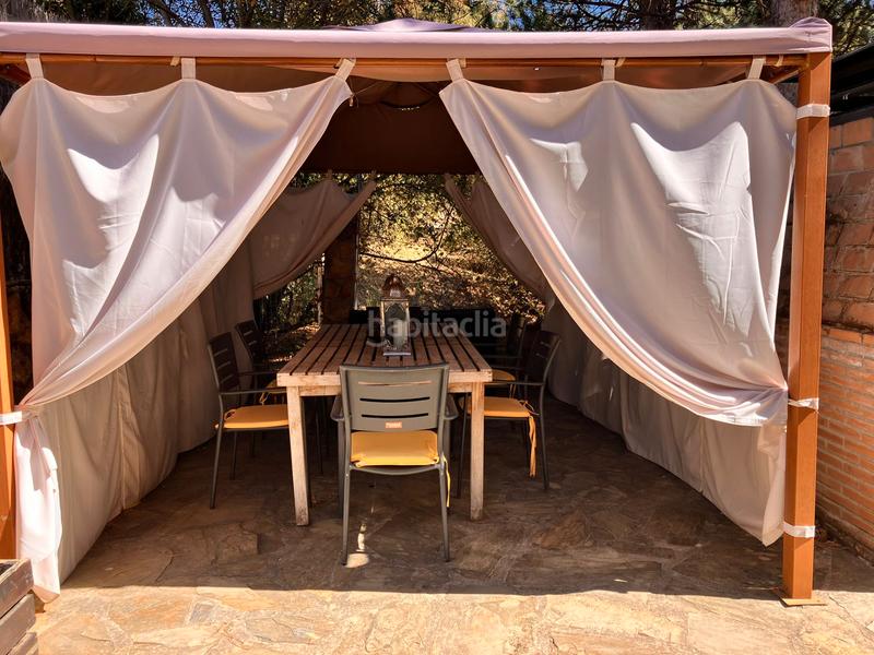 Foto f89d7865-2ca7-495a-8459-69a7272ae8f9. Chalet with fireplace heating in Mataelpino