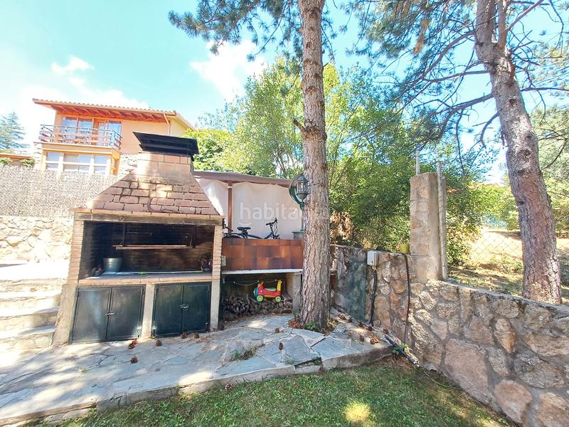 Foto b936f566-d744-418b-b8e4-ac914a199fd3. Chalet avec cheminée chauffage dans Mataelpino