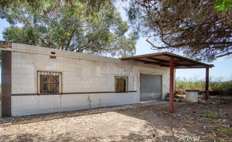 Foto 0d013aa4-14a6-44fe-b7ff-1379766d9200. Casa amb aparcament piscina a La Marina Elche / Elx