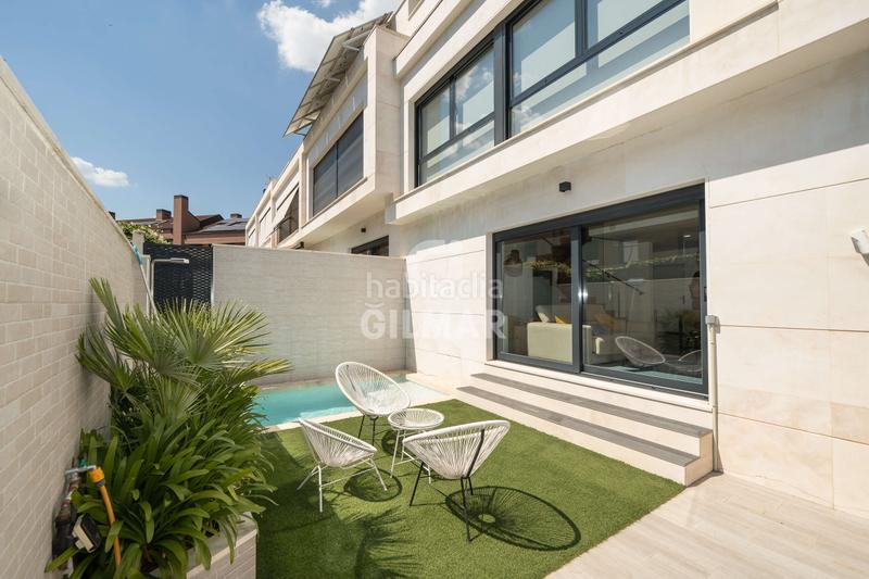 Foto 1aeecdf3-39fd-454e-99c6-d5523874a031. Casa aparellada amb calefacció aparcament piscina a Madrid