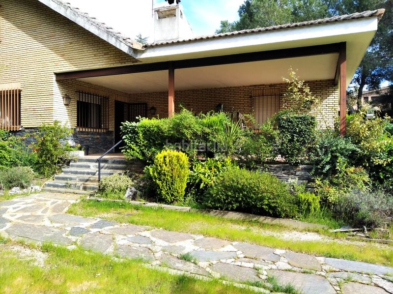 Foto d01b961c-ba08-4478-979d-80ba4b2fb813. Chalet con camino riscaldamento parcheggio piscina in Hoyo de Manzanares