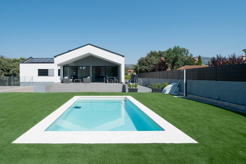 Foto 36fe96b6-b25d-47c2-94ea-45df70c6663e. Chalet avec cheminée chauffage parking piscine dans Guadalix de la Sierra