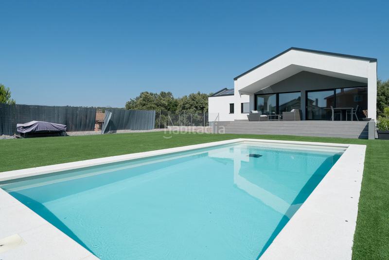 Foto 73bf2cdd-3fab-4a6c-a172-6a62a6c3b9f2. Chalet avec cheminée chauffage parking piscine dans Guadalix de la Sierra