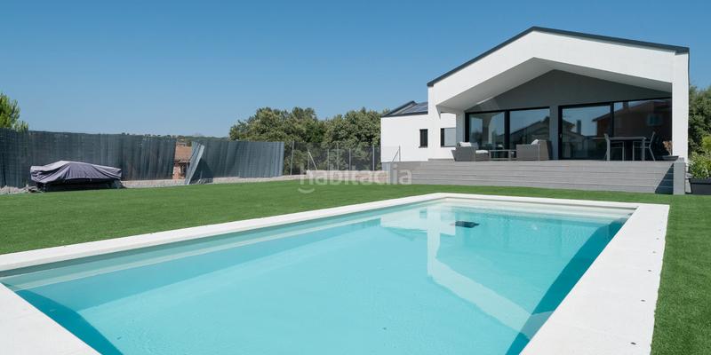 Foto ce89b7a9-41b5-47a8-ad62-98da21cb6f16. Chalet avec cheminée chauffage parking piscine dans Guadalix de la Sierra