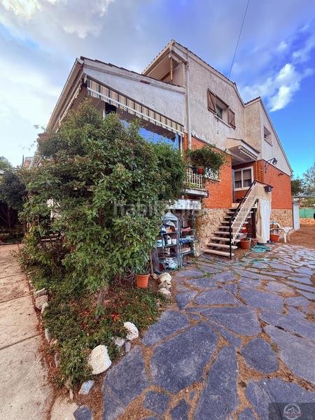 Foto ab0e2082-fadc-435c-8e45-ed571f07deb3. Casa aparellada amb calefacció aparcament a Becerril de la Sierra