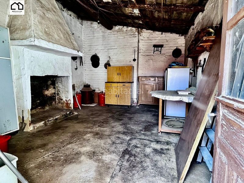 Foto 522b5809-d985-459c-8115-cf0180c77765. Masía apihouse vende casa de pueblo en planta baja con amplia parcela de 265 m2. precio 77.999 en Carmena