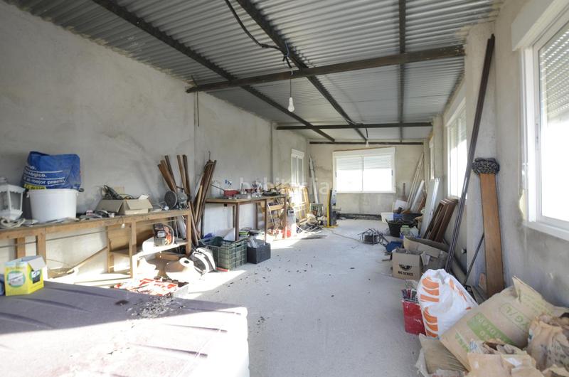 Foto 5518f25e-966a-4ac1-9df9-e1ab390c81d2. Casa aparellada amb calefacció piscina a Las Lomas Seseña