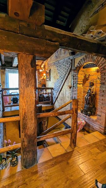 Foto dc1c6c25-7335-4ce5-8a9c-e4136533f3cd. Casa amb xemeneia calefacció a Sotosalbos