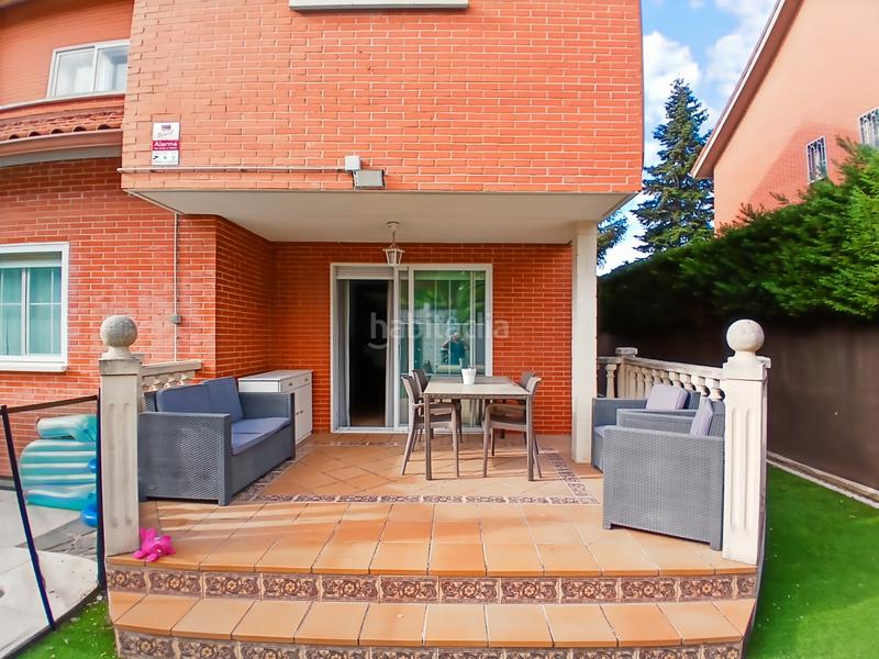 Foto c6a06ebc-c321-45fb-9bf2-699a1ddc3f41. Casa aparellada amb xemeneia calefacció aparcament piscina a Rivas - Vaciamadrid