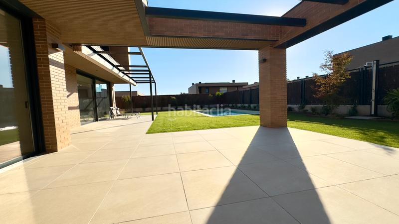 Foto d2bac722-35c7-4273-979a-723dbbd59e7c. Location chalet avec cheminée chauffage piscine dans Rozas de Madrid (Las)