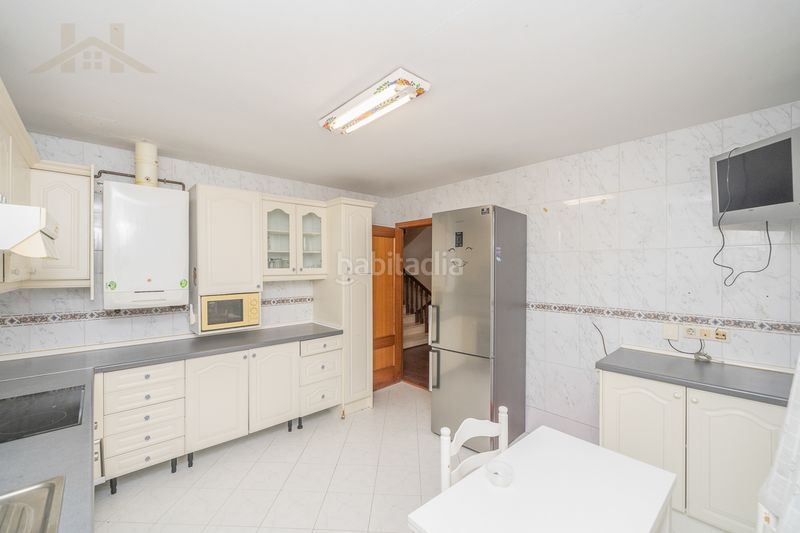 Foto 525e9691-b814-446a-9c13-aa3ee34cc921. Casa aparellada amb xemeneia calefacció aparcament piscina a Torrelodones