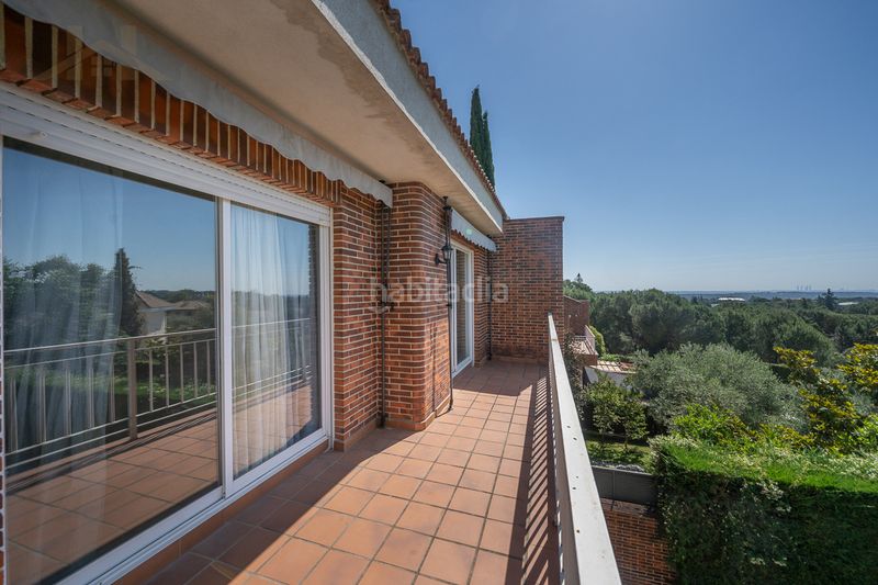 Foto a02cea12-b96b-4470-a891-fc282085f076. Casa aparellada amb xemeneia calefacció aparcament piscina a Torrelodones