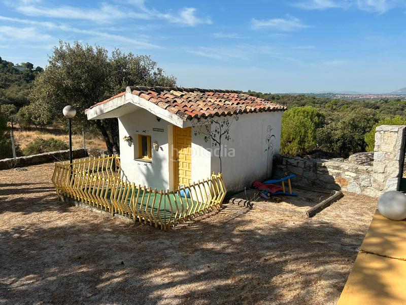 Foto 21d34eb9-ec54-4437-a78b-98388a6c3823. Chalet with fireplace heating pool in La Berzosilla Torrelodones