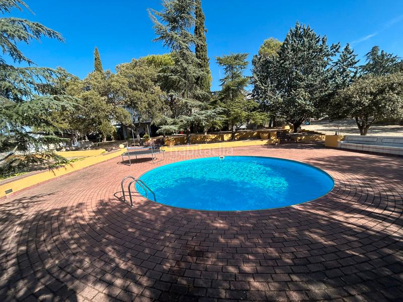 Foto 96d28296-92d9-4740-861c-0cb560051591. Chalet with fireplace heating pool in La Berzosilla Torrelodones