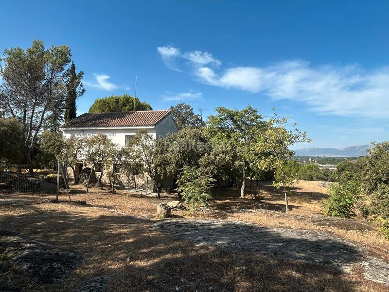 Foto c42456c6-dca7-4c43-894b-e10e9b2ae178. Chalet with fireplace heating pool in La Berzosilla Torrelodones