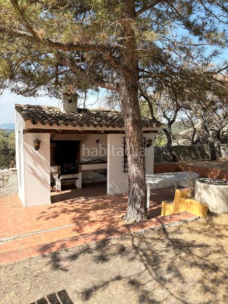 Foto d1d5cb30-bbff-40eb-8f67-d2f501e48a7c. Chalet with fireplace heating pool in La Berzosilla Torrelodones