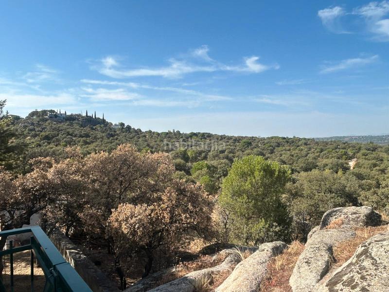 Foto f5aa90e1-24f7-49d6-b54f-f5bbbfe077b6. Chalet with fireplace heating pool in La Berzosilla Torrelodones